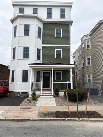 a front view of a house with garage