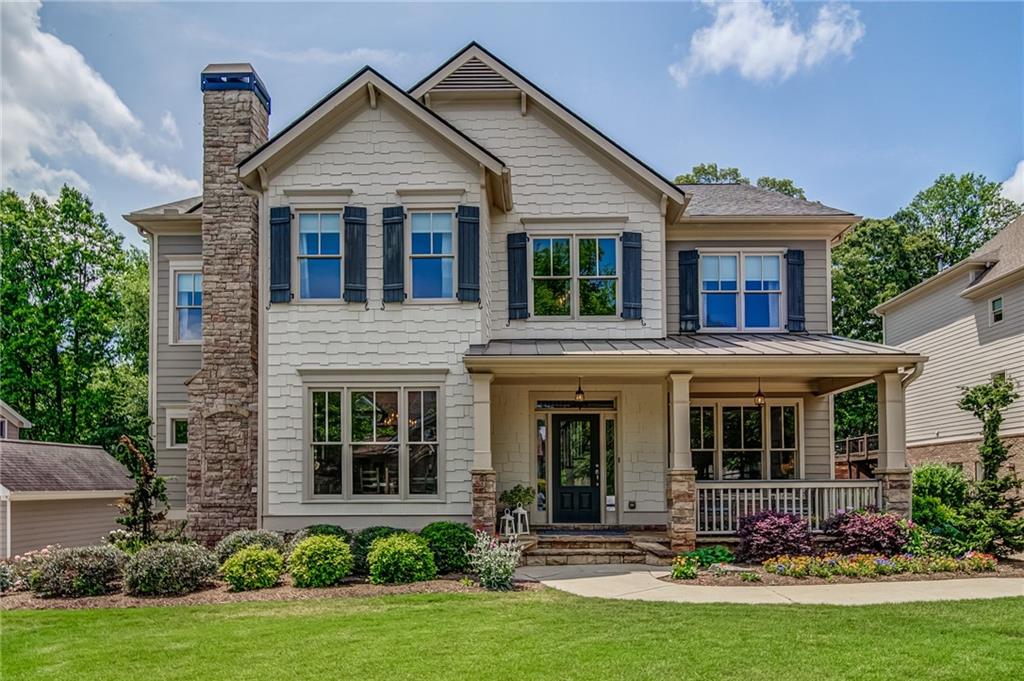 front view of a house with potted plants