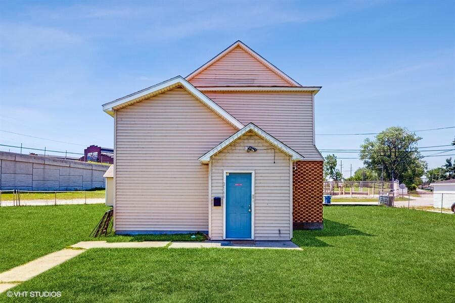 2140 Indianapolis Boulevard Whiting, IN 46394 - Photo 1 of 63 a front view of a house with a yard and porch