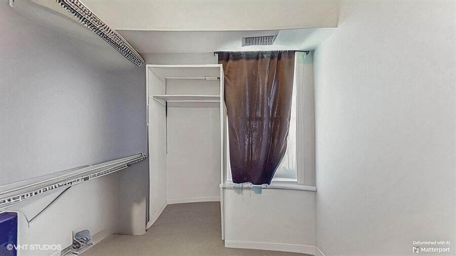 2140 Indianapolis Boulevard Whiting, IN 46394 - Photo 12 of 63 a view of walk in closet with clothes and shoes