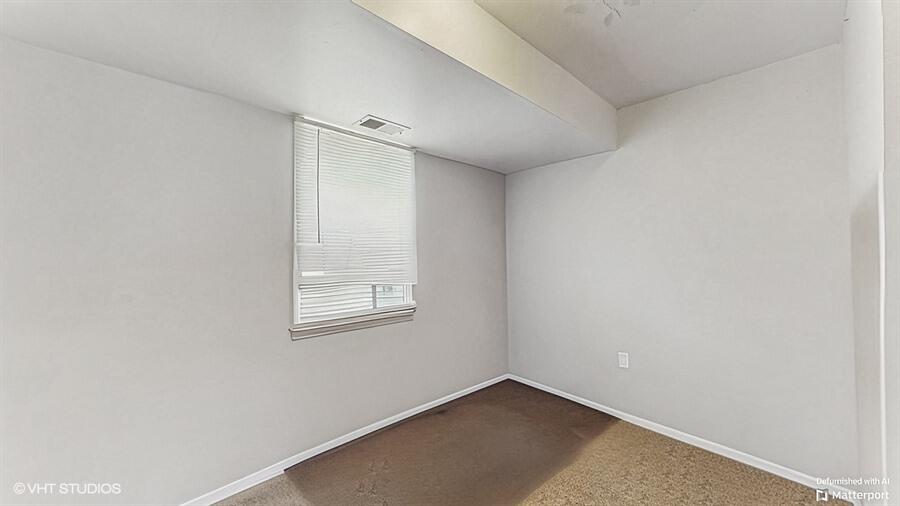 2140 Indianapolis Boulevard Whiting, IN 46394 - Photo 15 of 63 an empty room with a window