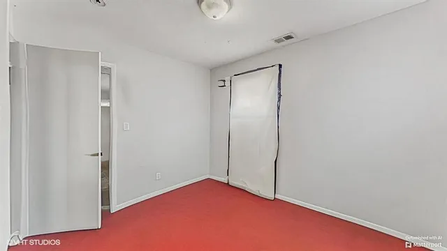 a bathroom with a shower curtain and a curtain