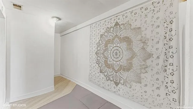 a view of a kitchen with a sink and cabinets