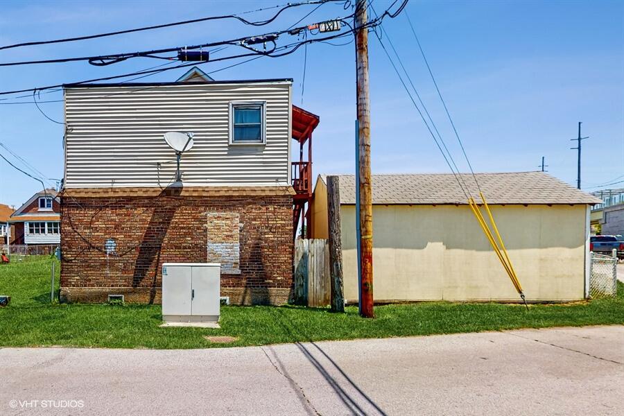 2140 Indianapolis Boulevard Whiting, IN 46394 - Photo 32 of 63 a front view of a house with a garden