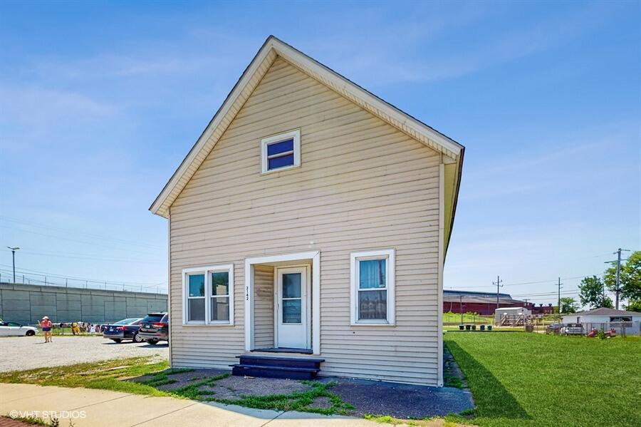 2140 Indianapolis Boulevard Whiting, IN 46394 - Photo 36 of 63 a view of a house with a yard
