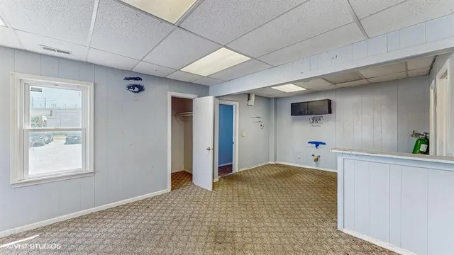 a front view of a house with a garden and yard