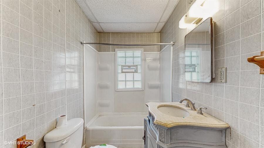 2140 Indianapolis Boulevard Whiting, IN 46394 - Photo 47 of 63 a bathroom with a sink toilet and shower