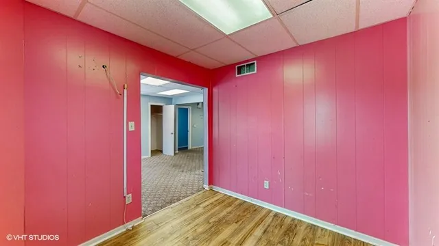a front view of a house with garden and porch