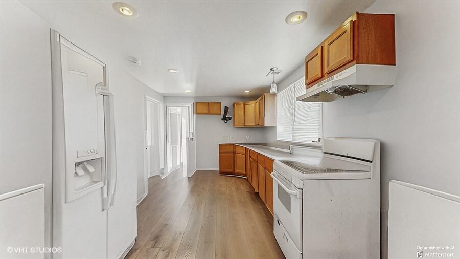 2140 Indianapolis Boulevard Whiting, IN 46394 - Photo 7 of 63 a kitchen with stainless steel appliances granite countertop a sink and cabinets