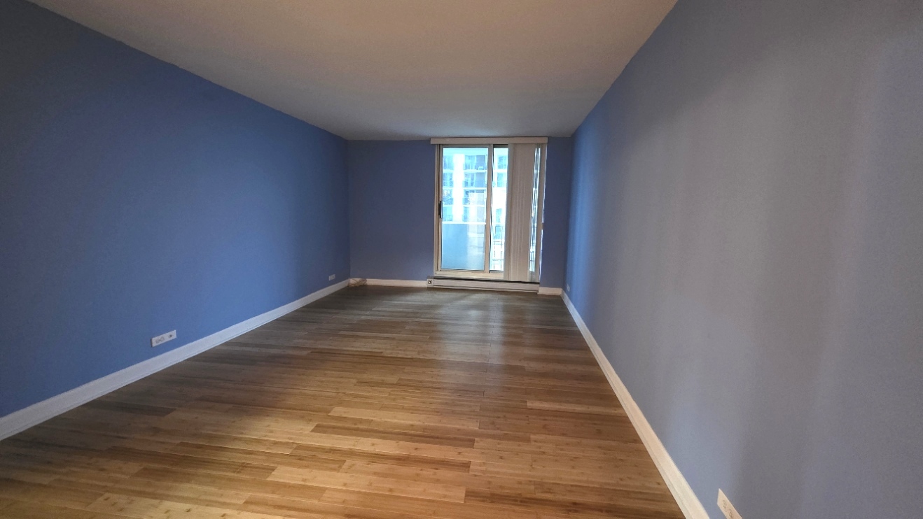 6033 North Sheridan Road, Unit 5G Chicago, IL 60660 - Photo 10 of 24 a view of an empty room and window