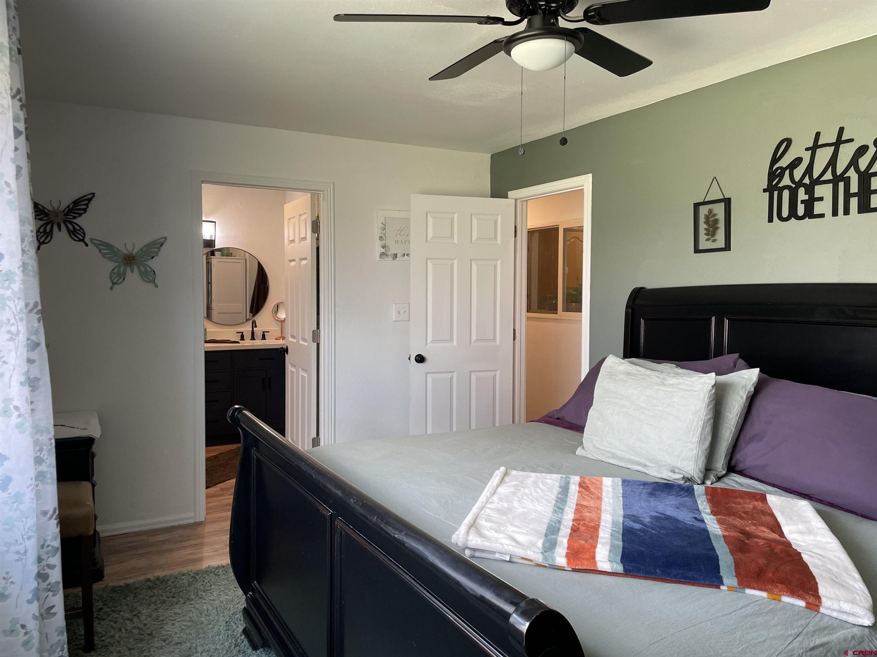 8902 6085 Road Montrose, CO 81401 - Photo 14 of 31 a living room with furniture and a wooden floor