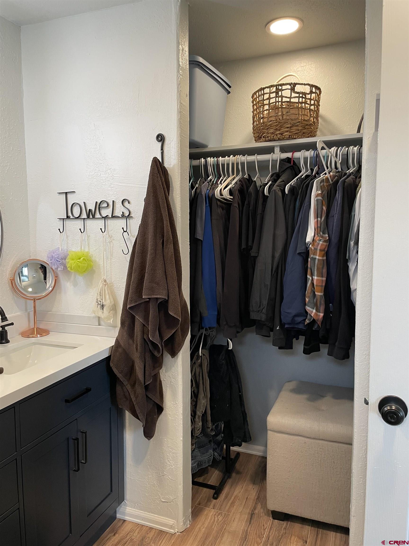8902 6085 Road Montrose, CO 81401 - Photo 16 of 31 a view of walk in closet with clothes and shoes