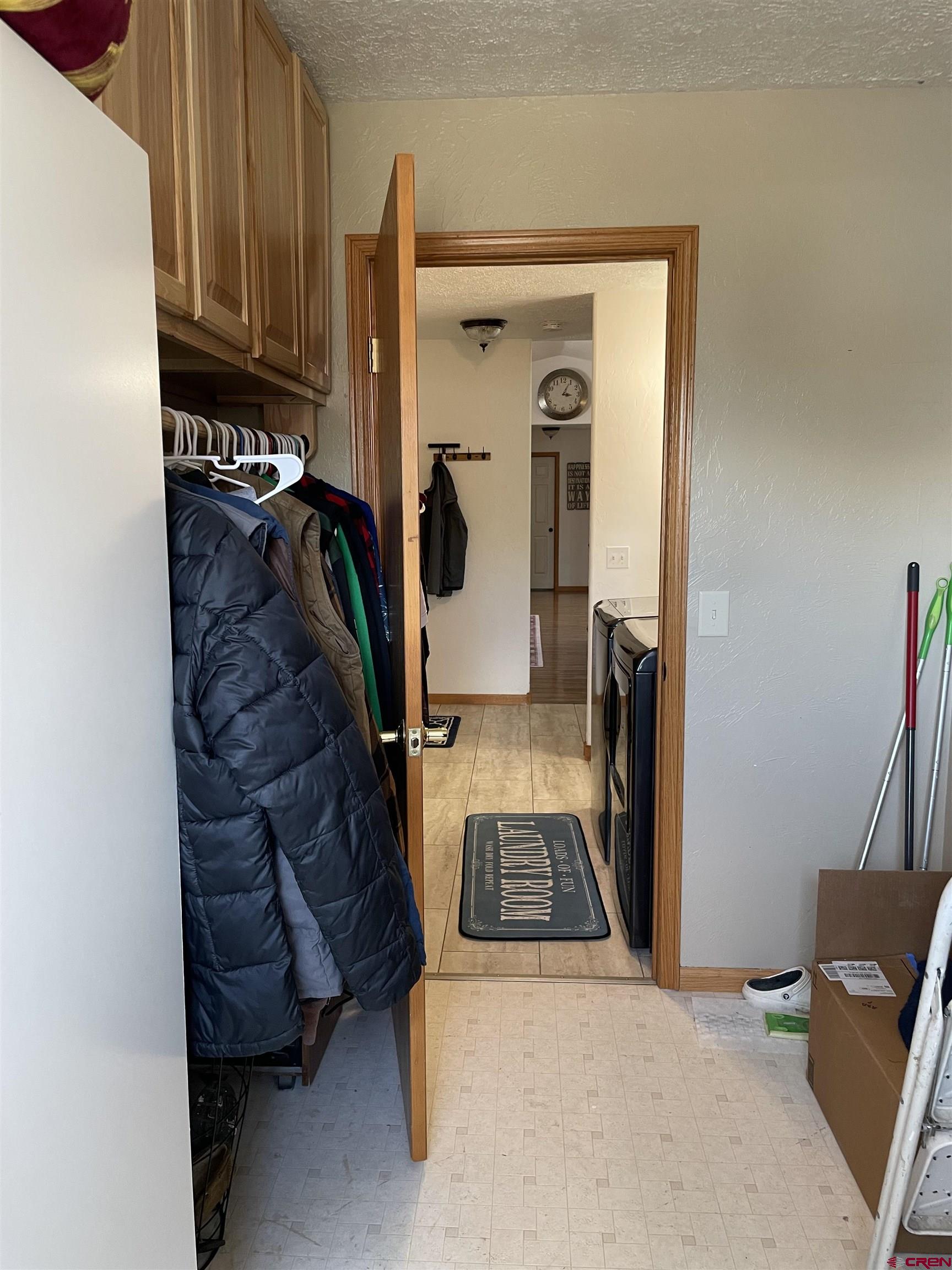 8902 6085 Road Montrose, CO 81401 - Photo 18 of 31 a view of walk in closet with clothes and shoes