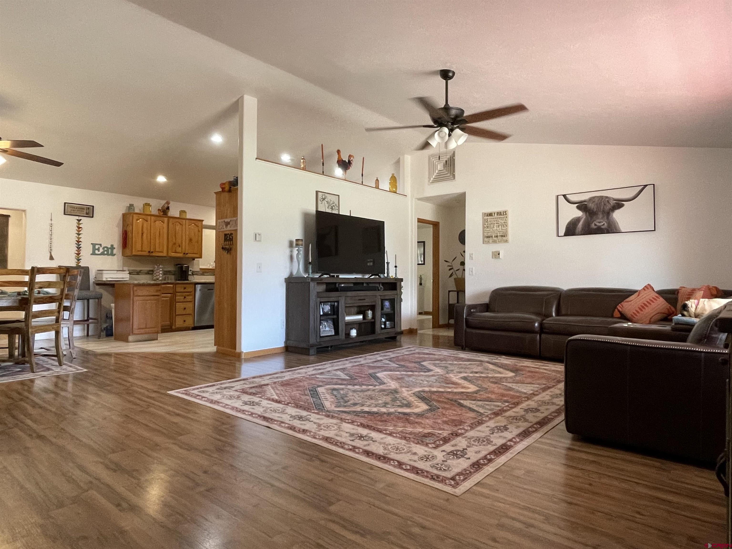 8902 6085 Road Montrose, CO 81401 - Photo 2 of 31 a living room with furniture and a flat screen tv