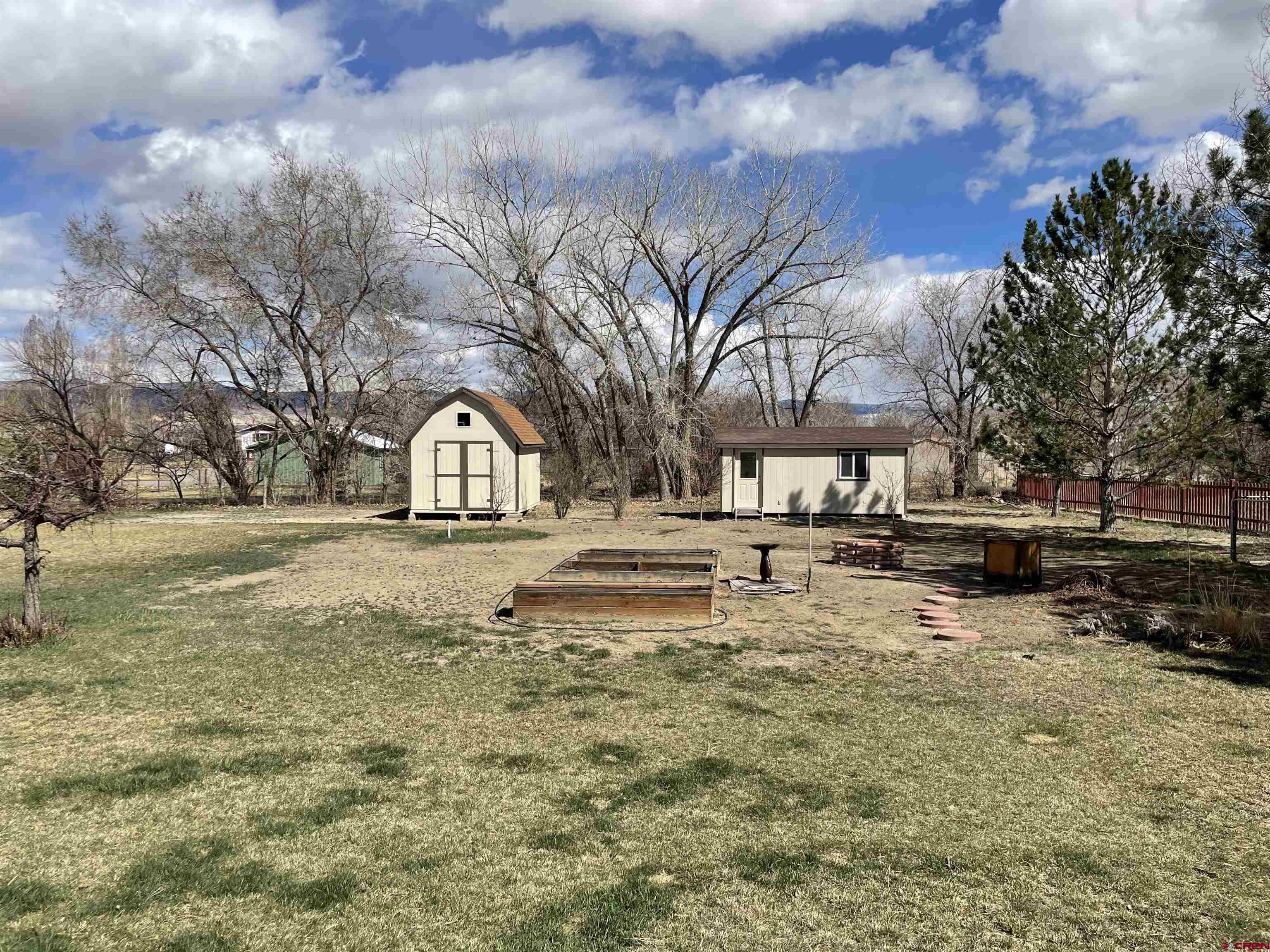 8902 6085 Road Montrose, CO 81401 - Photo 23 of 31 a view of yard covered with snow in front of house