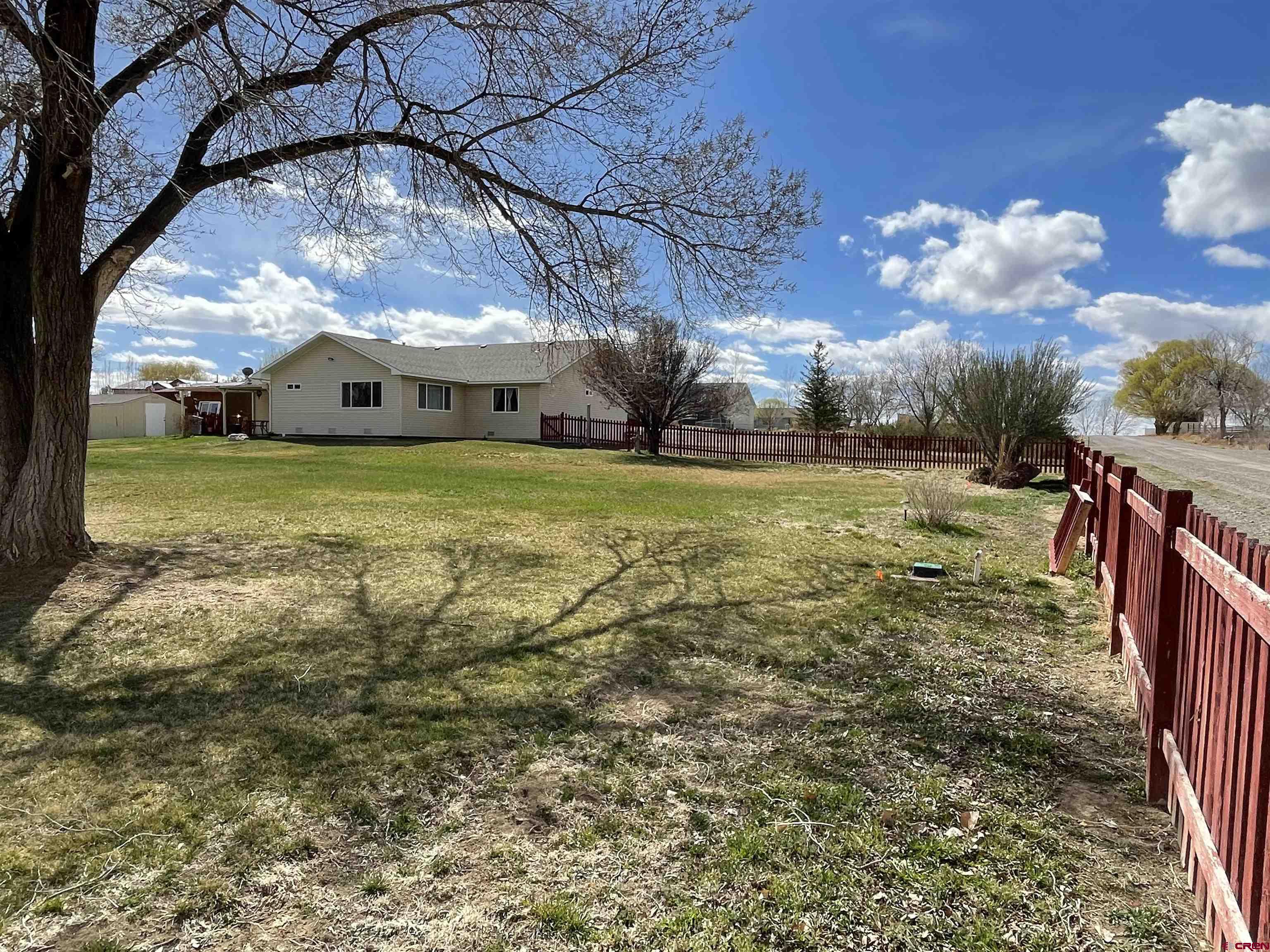 8902 6085 Road Montrose, CO 81401 - Photo 29 of 31 a view of a house with a big yard