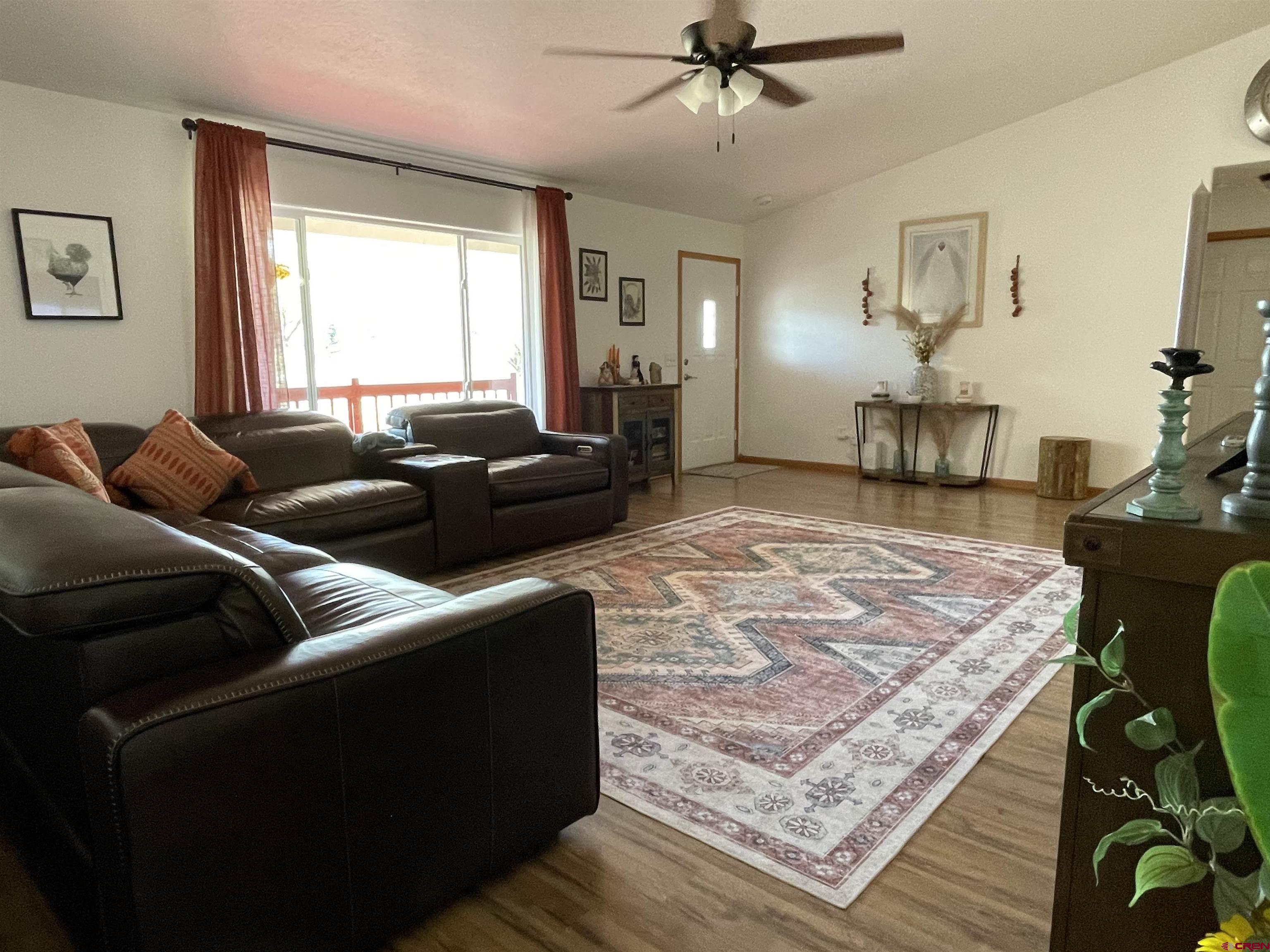 8902 6085 Road Montrose, CO 81401 - Photo 5 of 31 a living room with furniture and a window