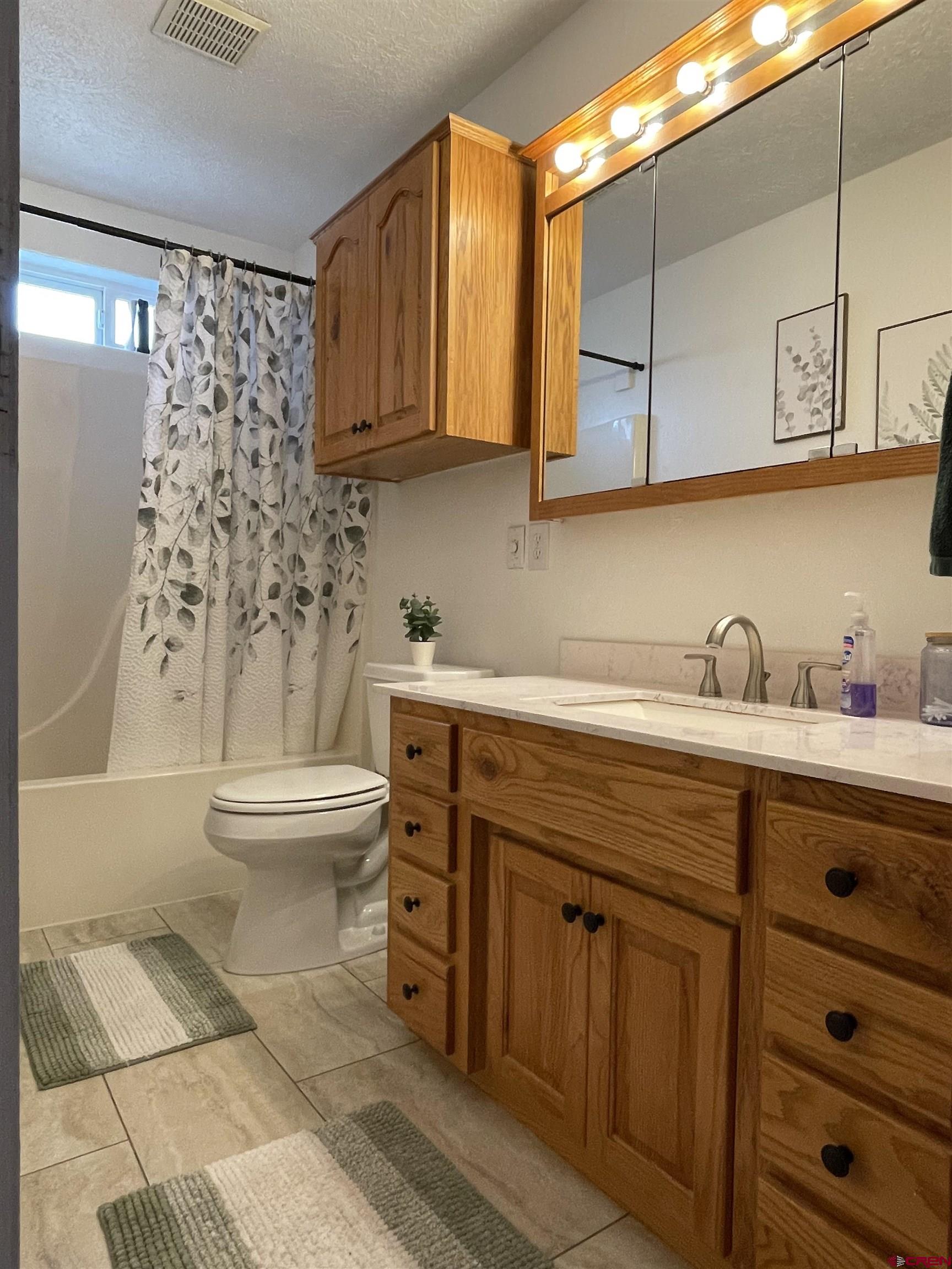 8902 6085 Road Montrose, CO 81401 - Photo 9 of 31 a spacious bathroom with a sink toilet and shower