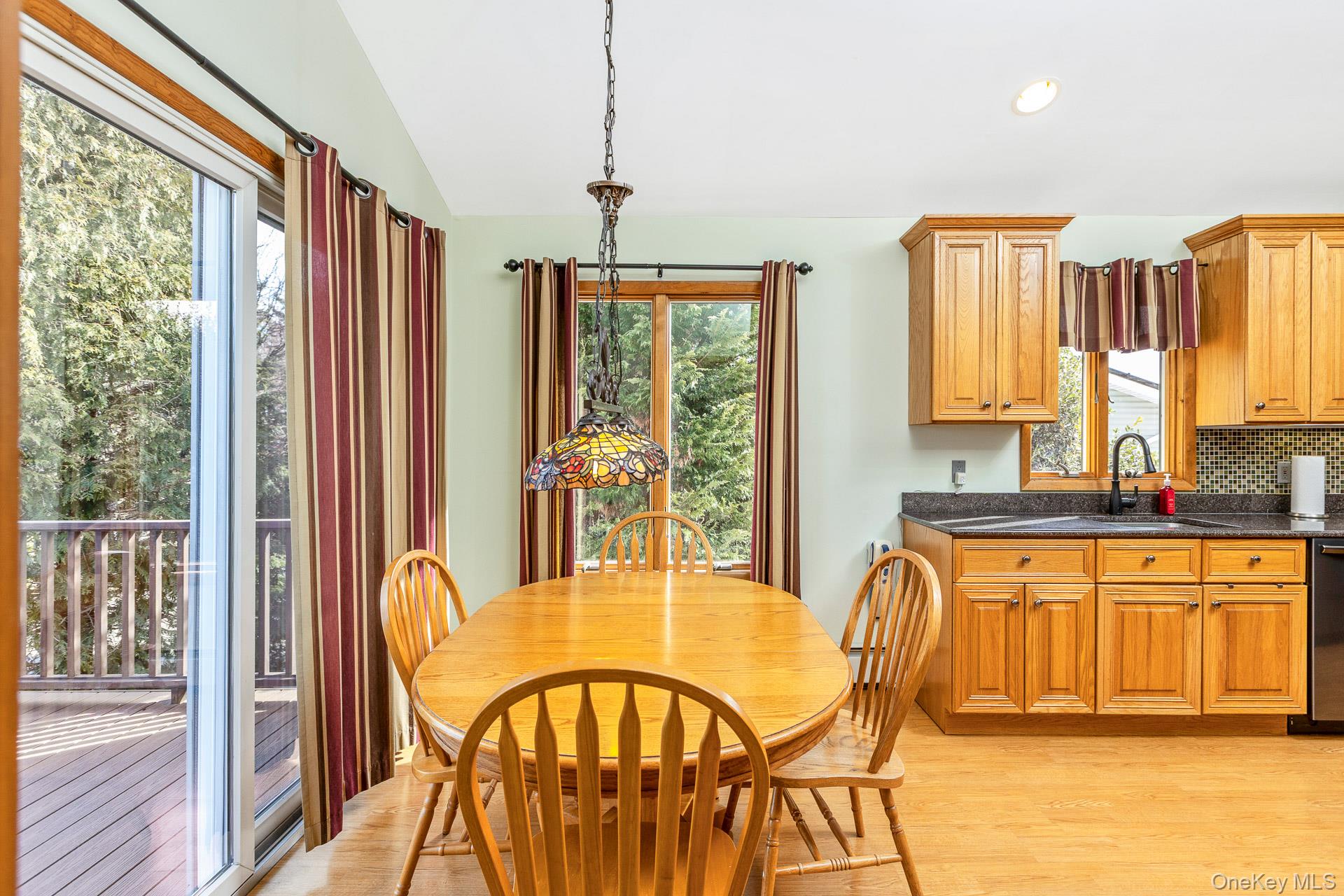 173 Fifty Acre Road South Smithtown, NY 11787 - Photo 15 of 42 a view of a dining room with furniture and a window