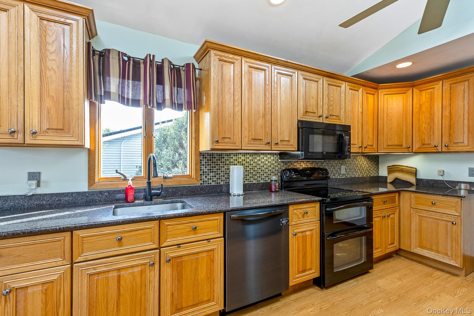 173 Fifty Acre Road South Smithtown, NY 11787 - Photo 21 of 42 a kitchen with stainless steel appliances granite countertop a sink a stove and cabinets