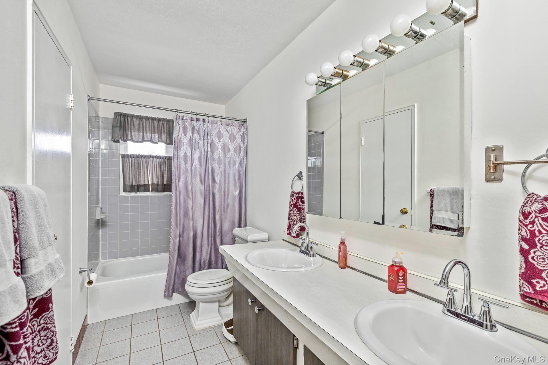 173 Fifty Acre Road South Smithtown, NY 11787 - Photo 23 of 42 a bathroom with a sink toilet tub and shower
