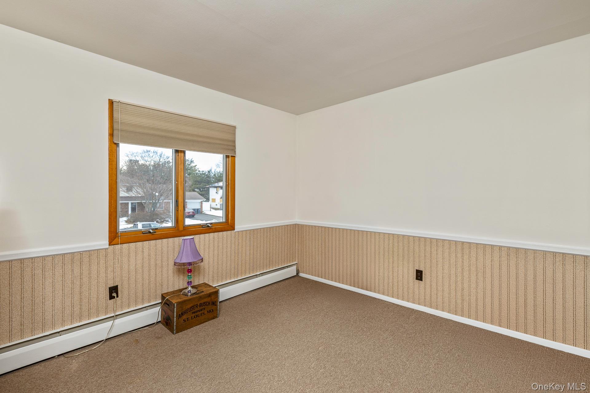 173 Fifty Acre Road South Smithtown, NY 11787 - Photo 26 of 42 an empty room with a window