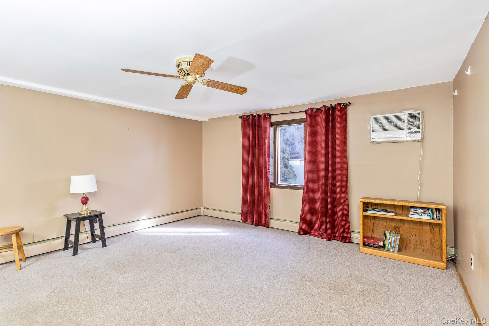 173 Fifty Acre Road South Smithtown, NY 11787 - Photo 27 of 42 a view of a livingroom with a piano and wooden floor
