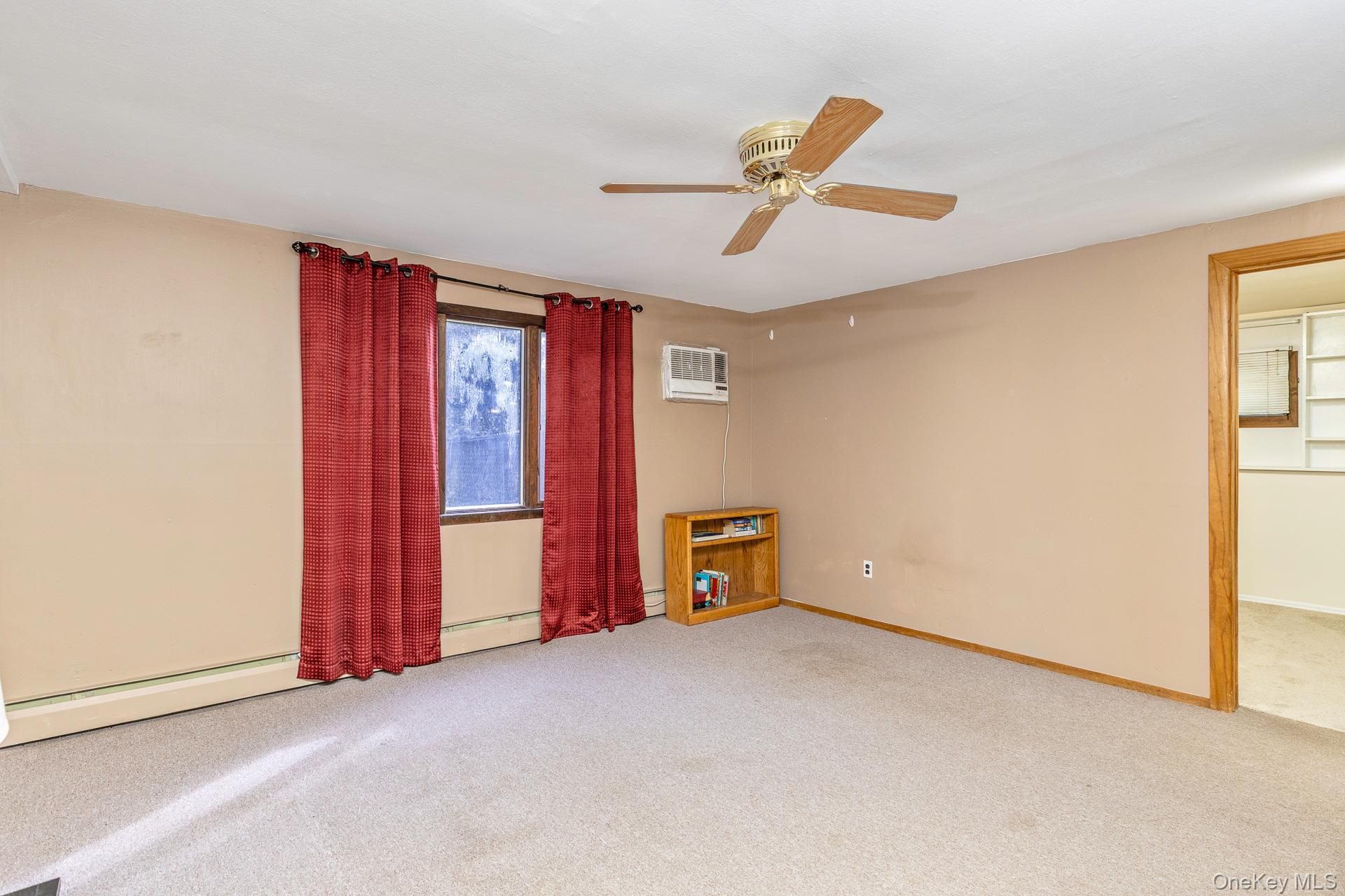 173 Fifty Acre Road South Smithtown, NY 11787 - Photo 28 of 42 an empty room with windows and closet
