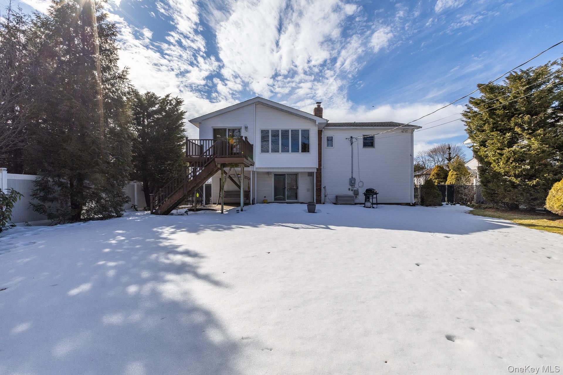 173 Fifty Acre Road South Smithtown, NY 11787 - Photo 35 of 42 a front view of a house with a yard