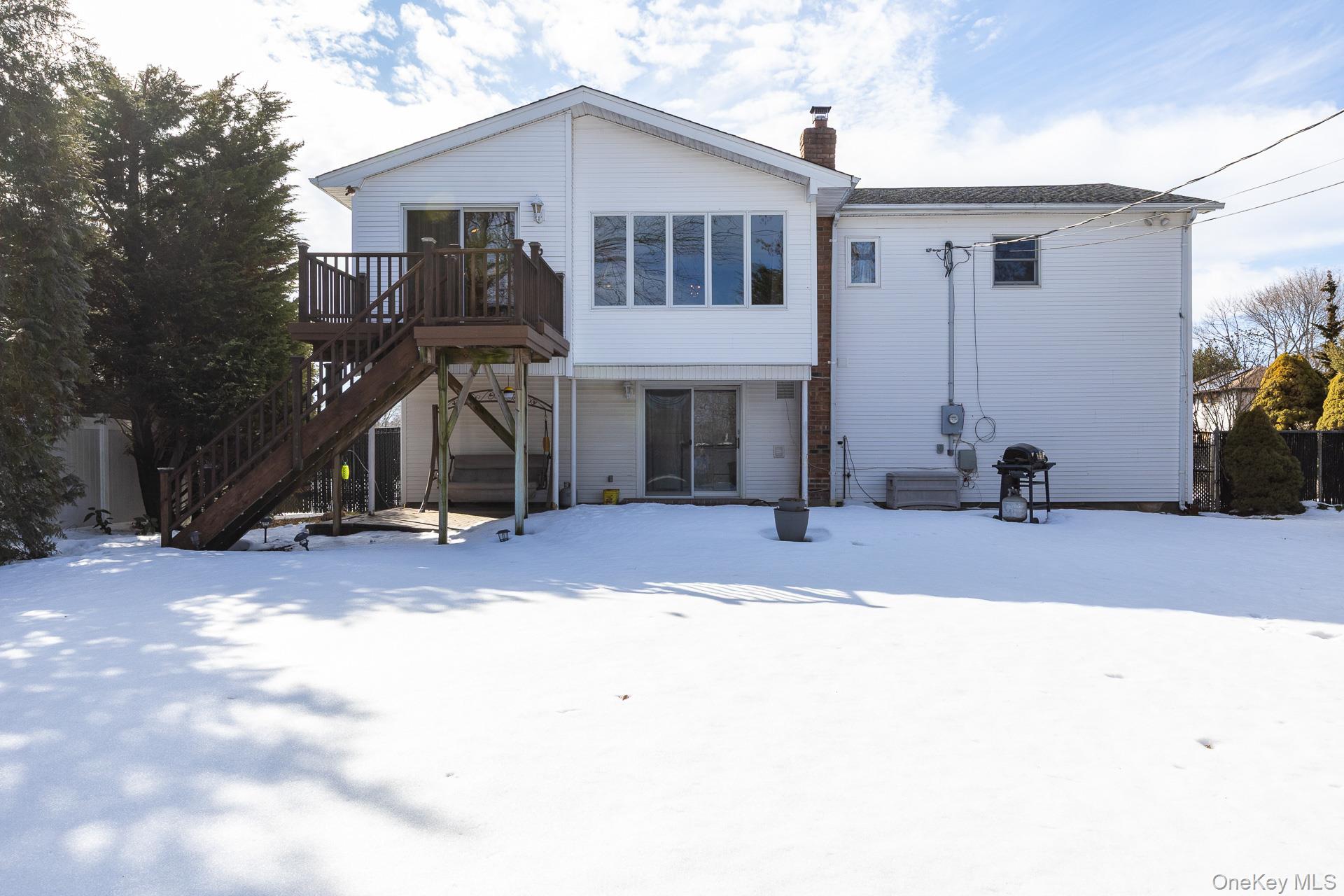 173 Fifty Acre Road South Smithtown, NY 11787 - Photo 36 of 42 a view of a house with a patio