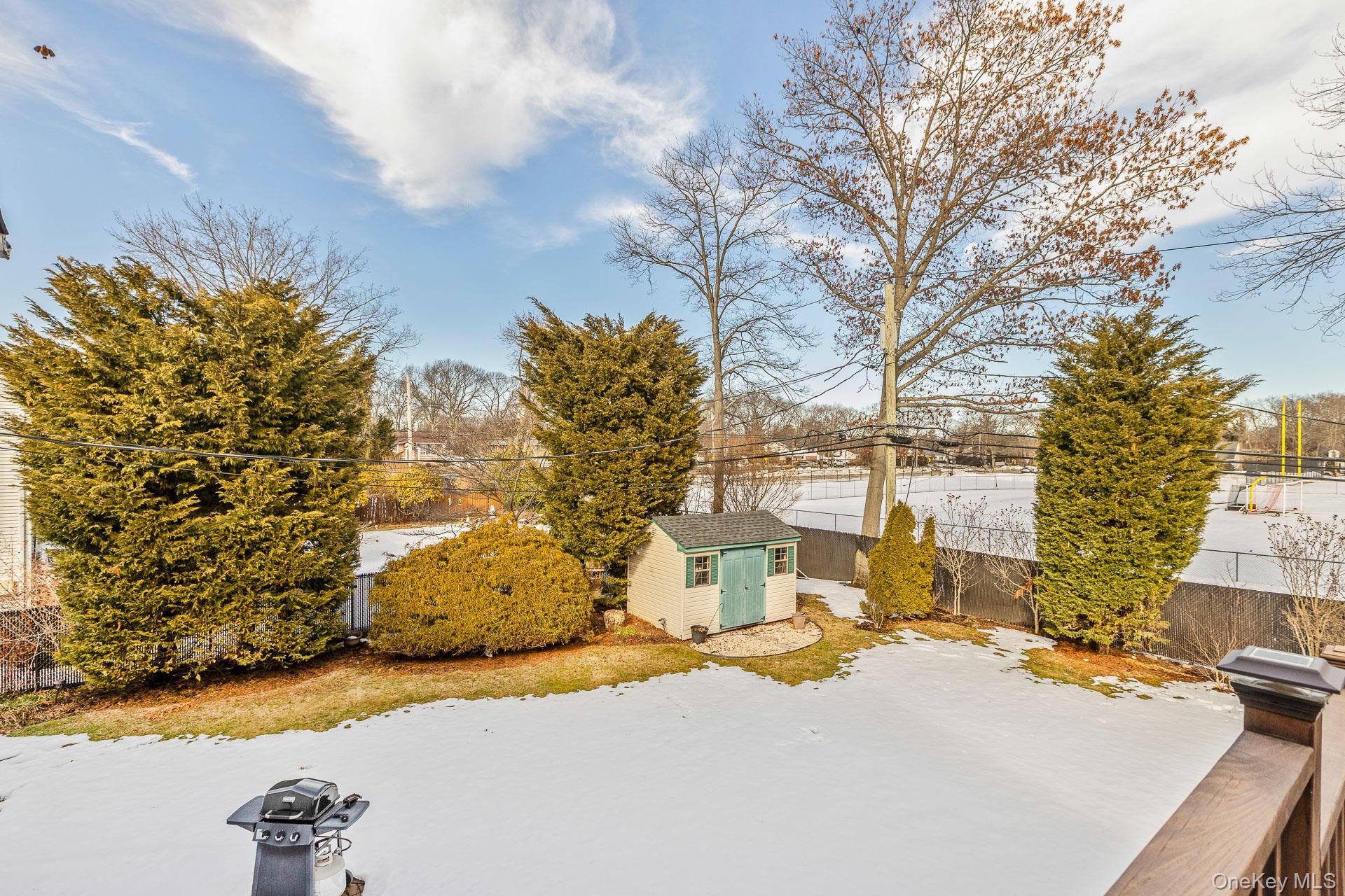 173 Fifty Acre Road South Smithtown, NY 11787 - Photo 41 of 42 a view of a house with a yard