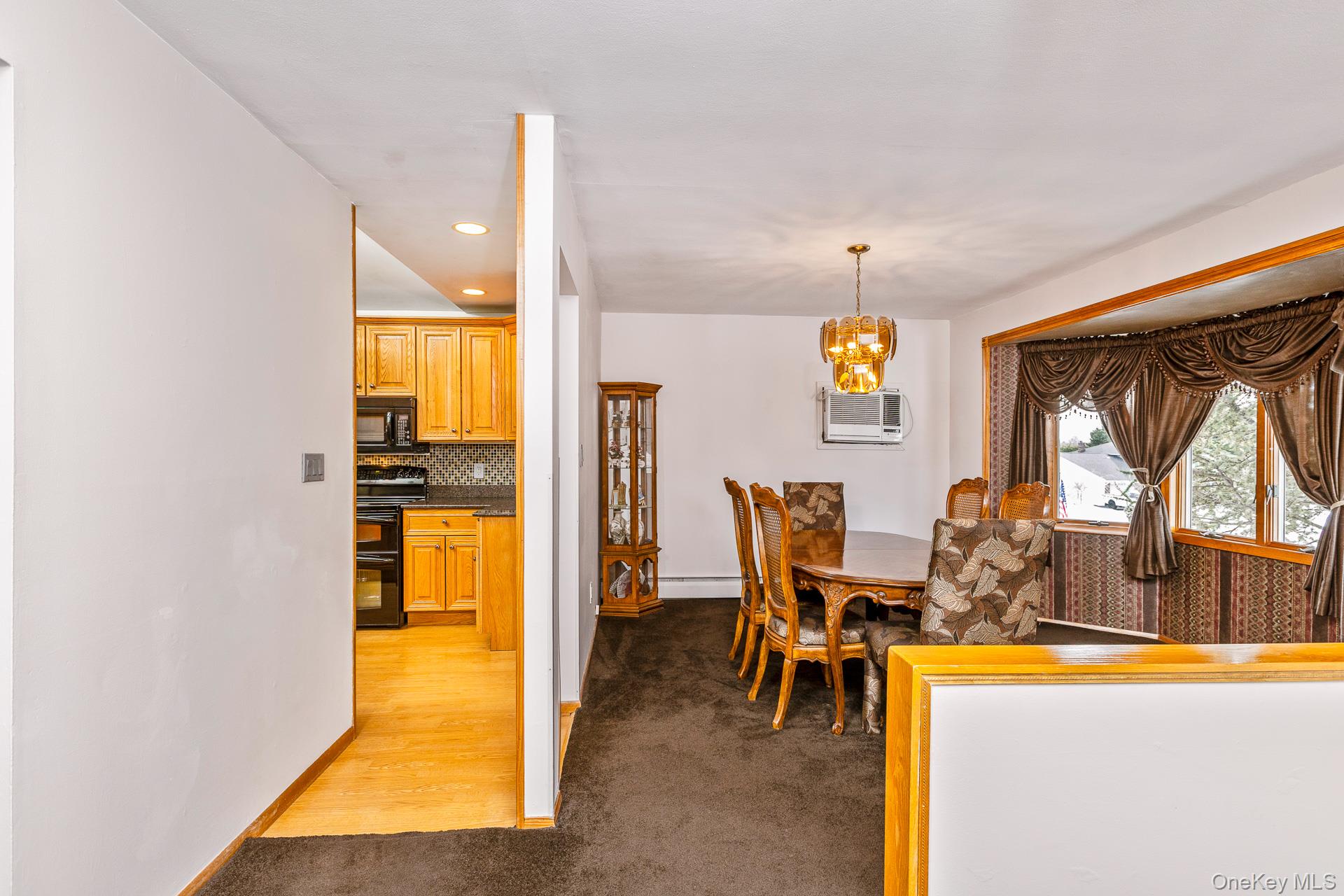 173 Fifty Acre Road South Smithtown, NY 11787 - Photo 10 of 42 a view of a dining room with furniture window and outside view