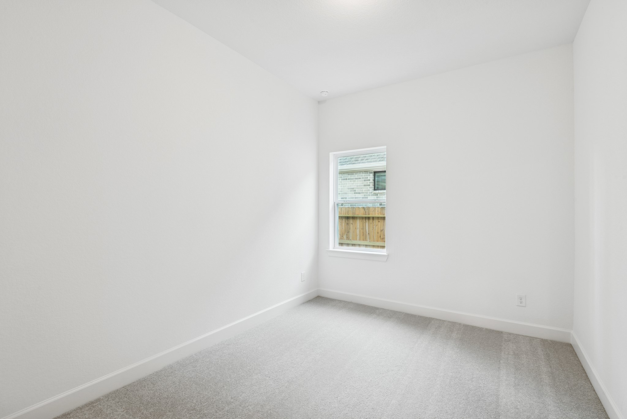 15714 Terracotta Terrace Lane Conroe, TX 77302 - Photo 20 of 47 a view of an empty room with a window