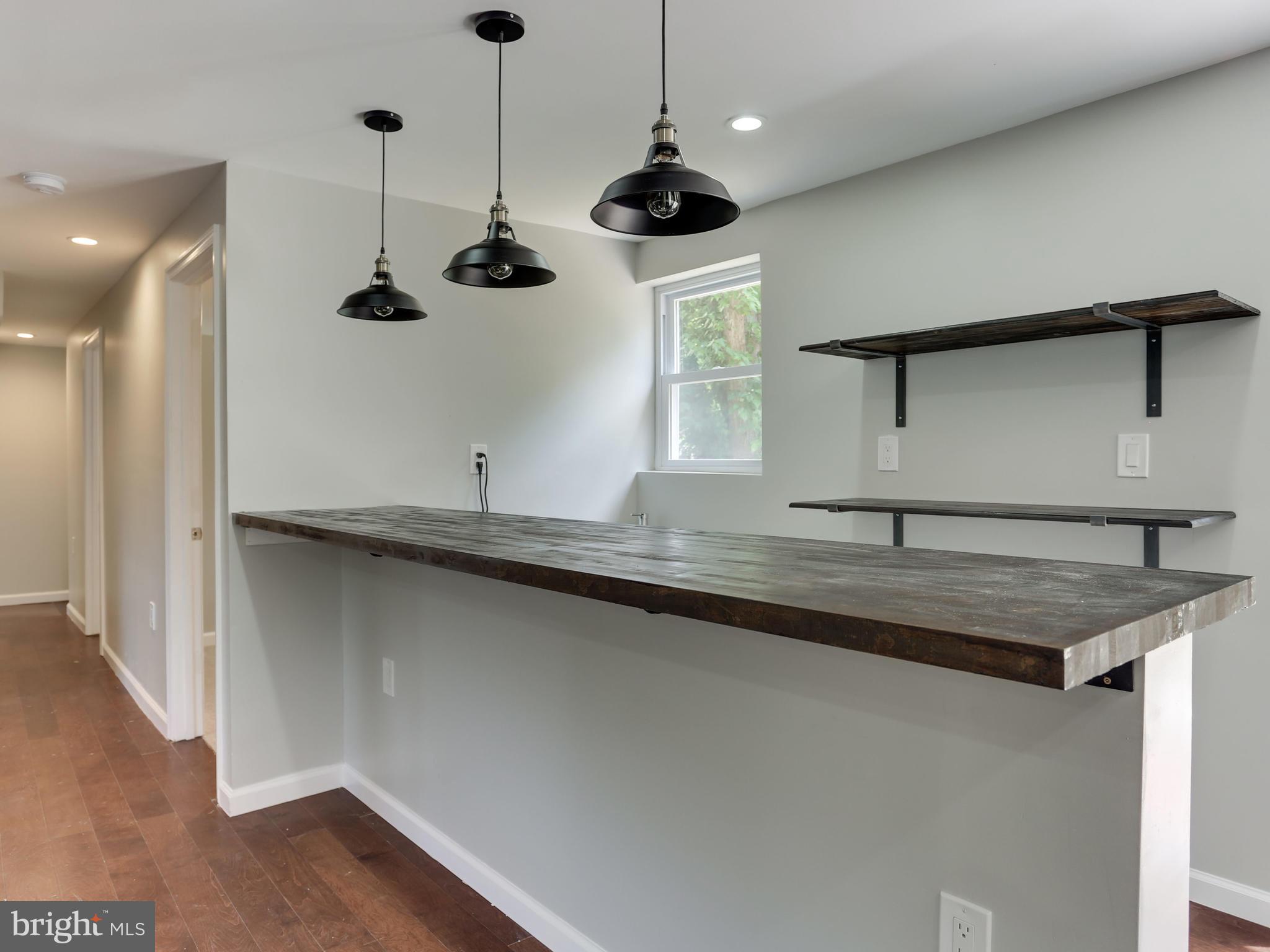 11218 Brandywine Road Clinton, MD 20735 - Photo 22 of 28 Wet bar in naturally lighted basement