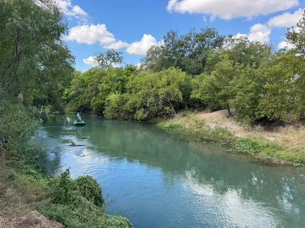 a view of a lake from a yard