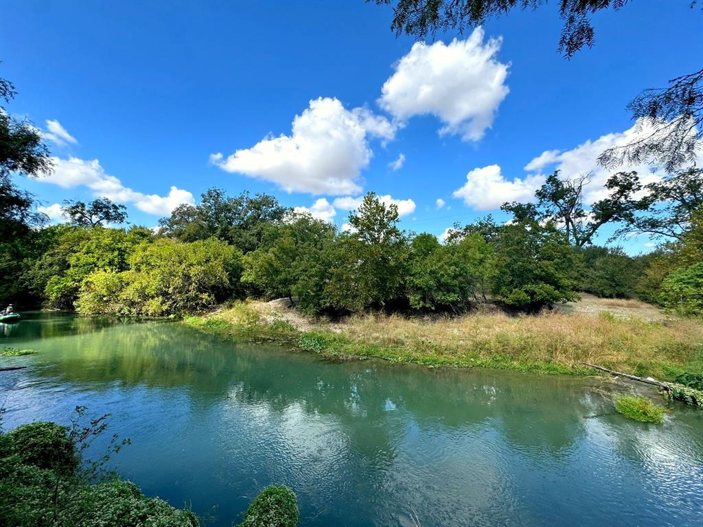 4194 Southeast River Road Martindale, TX 78655 - Photo 21 of 30 a view of a lake with a yard