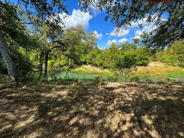 a view of lake with green space
