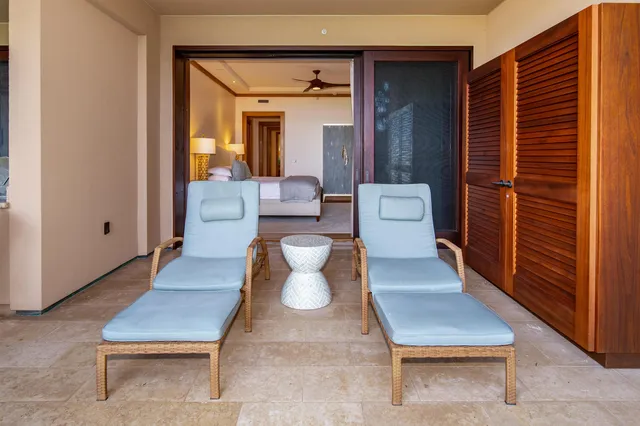 a living room with furniture and a entryway