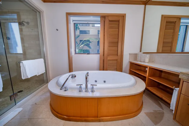 a bathroom with a shower and a sink