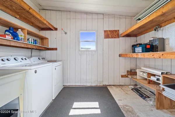 a storage utility room with a sink