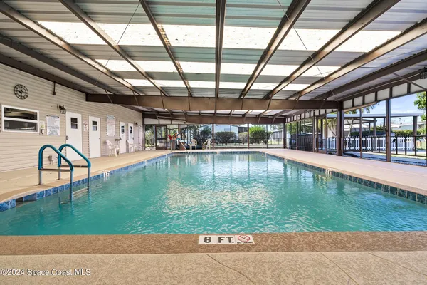 a swimming pool with view of outdoor space