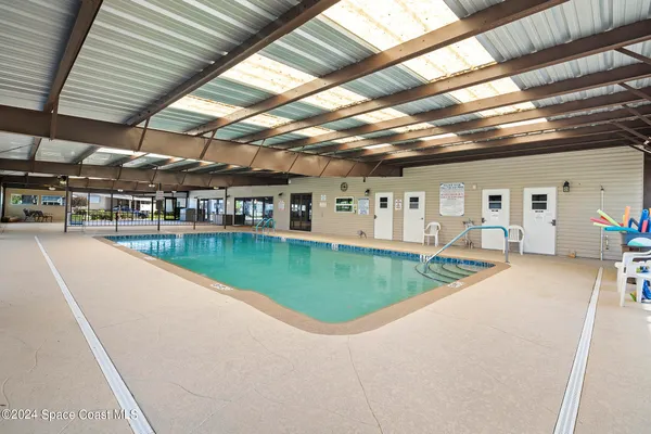 a view of a swimming pool with a patio