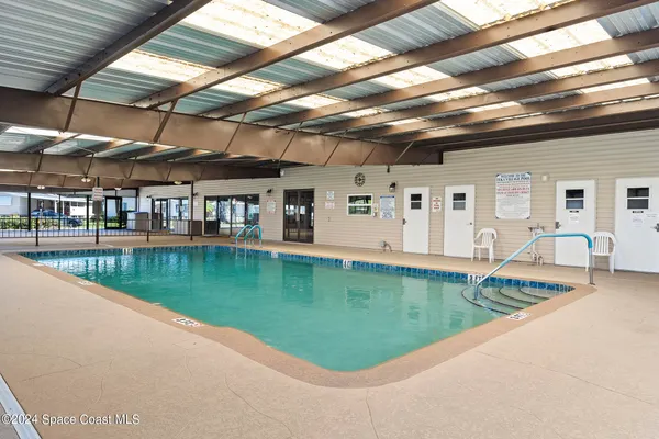 a view of a house with swimming pool