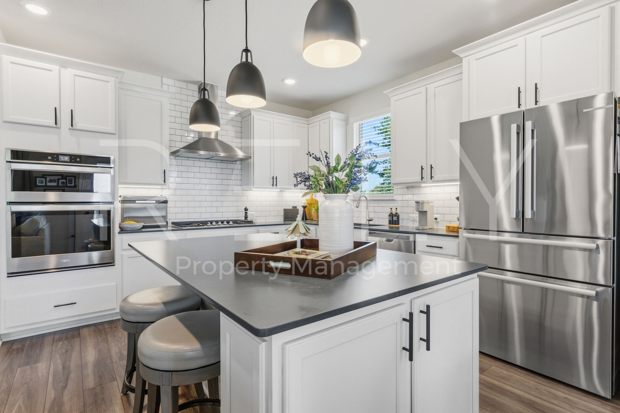 101 Spanish Star Street Georgetown, TX 78633 - Photo 12 of 39 An inviting kitchen features a central island, recessed lighting, and modern stainless steel appliances.