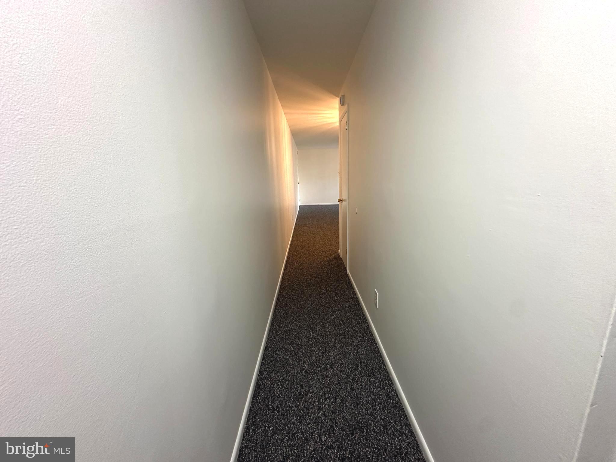 4254 Buckman Road, Unit 5 Alexandria, VA 22309 - Photo 12 of 20 a view of a hallway with a white walls