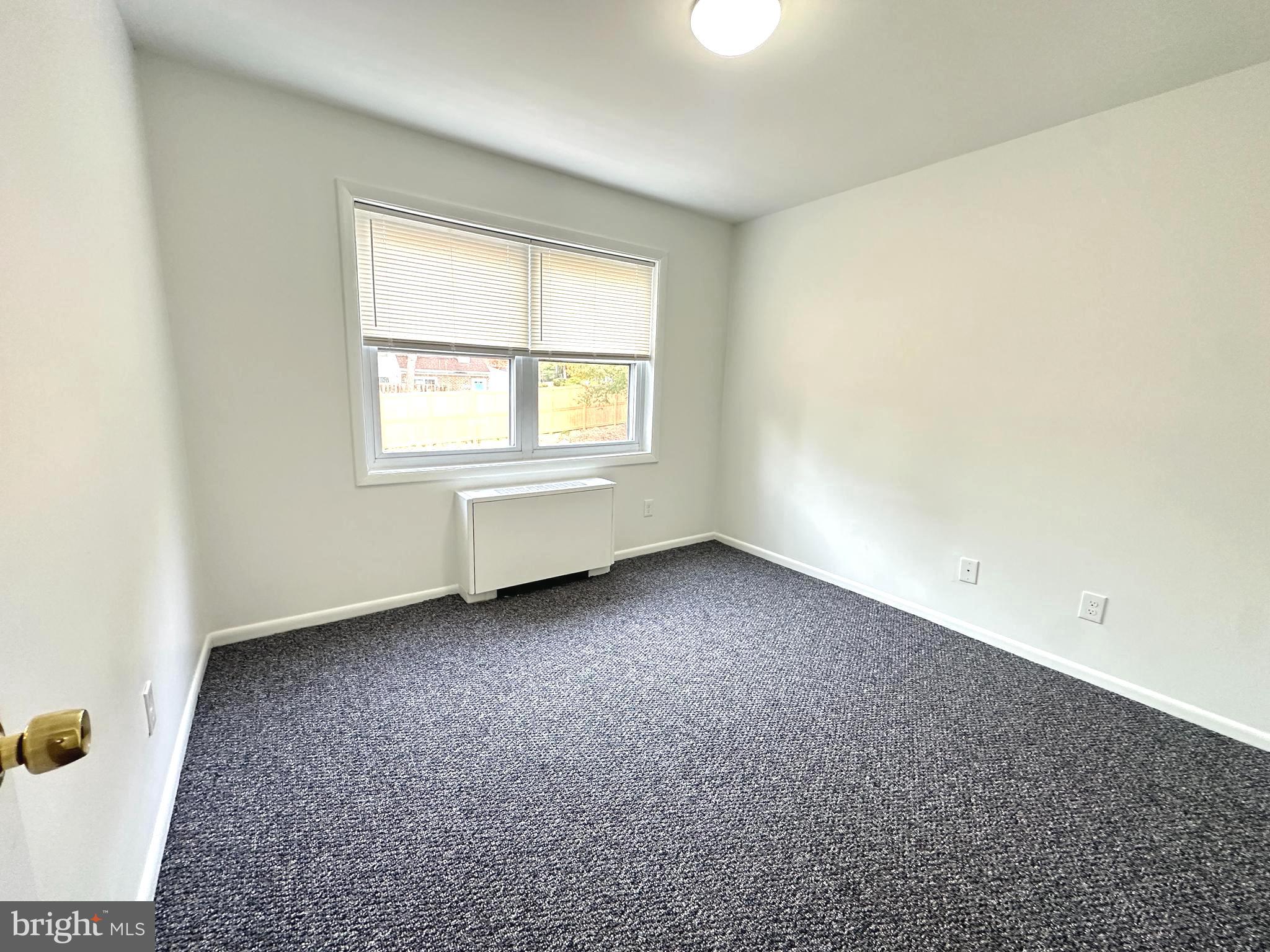 4254 Buckman Road, Unit 5 Alexandria, VA 22309 - Photo 13 of 20 an empty room with a window