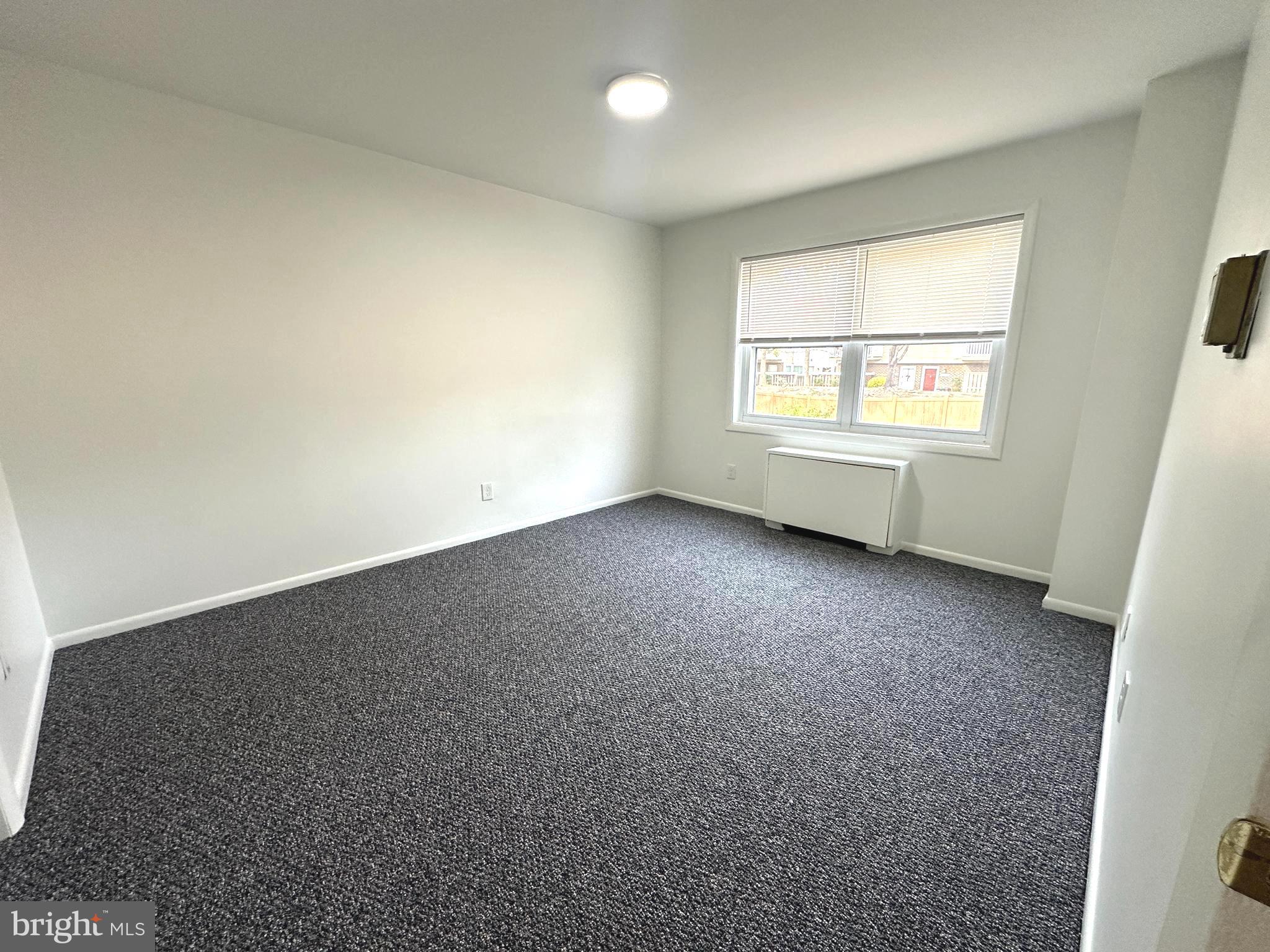 4254 Buckman Road, Unit 5 Alexandria, VA 22309 - Photo 15 of 20 an empty room with a window