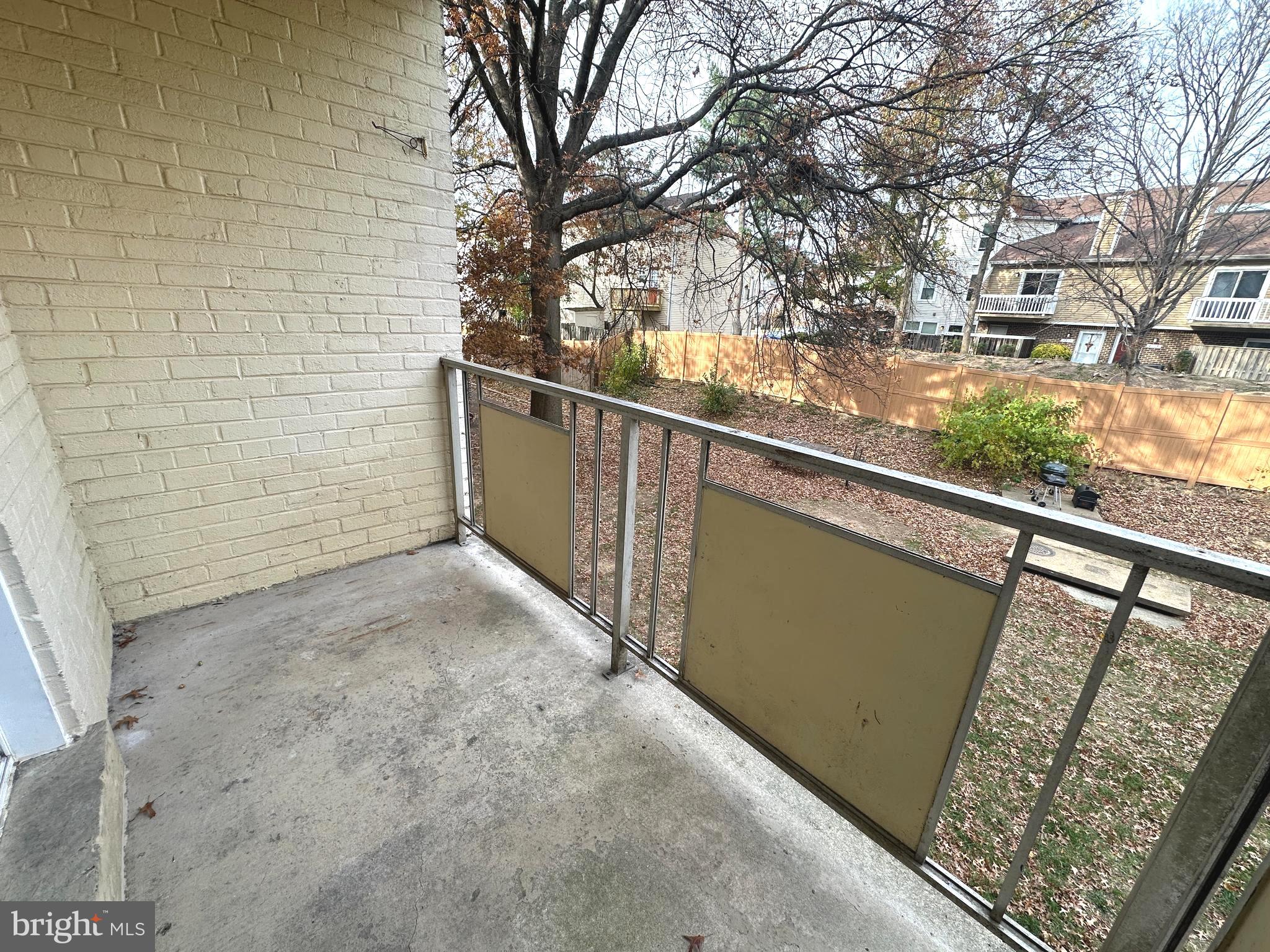 4254 Buckman Road, Unit 5 Alexandria, VA 22309 - Photo 19 of 20 a view of a balcony with wooden floor and fence