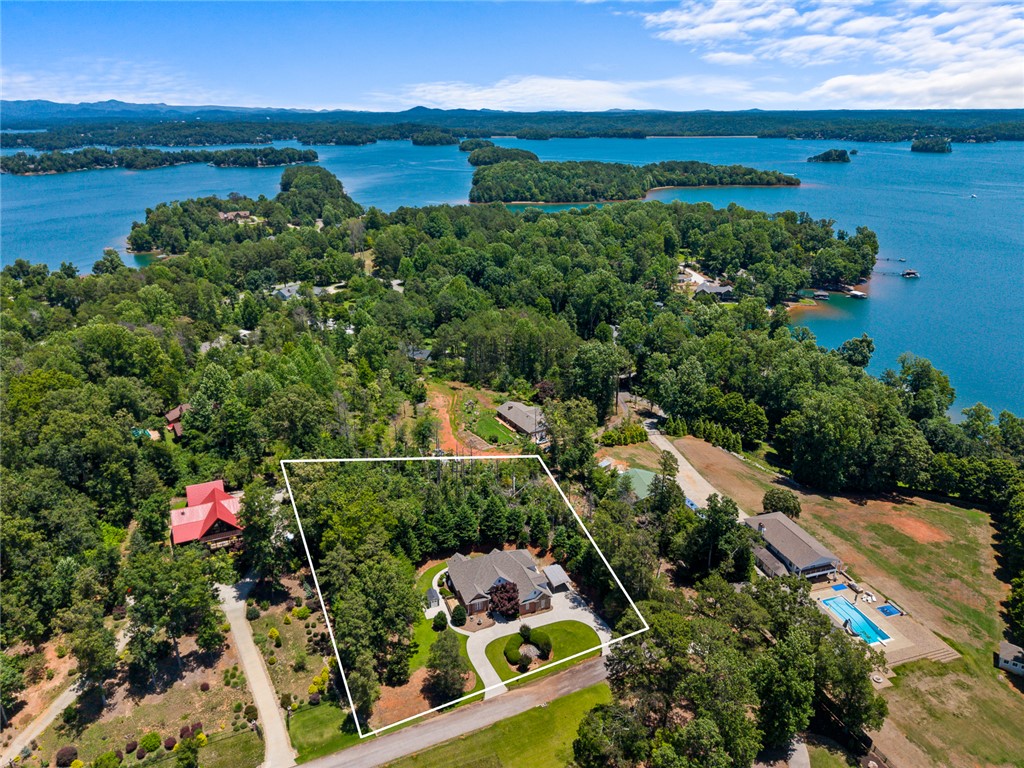 135 Sunset Bay Boulevard Seneca, SC 29672 - Photo 49 of 50 Perched on a verdant hillside, this property offers serene lake views and a private driveway.