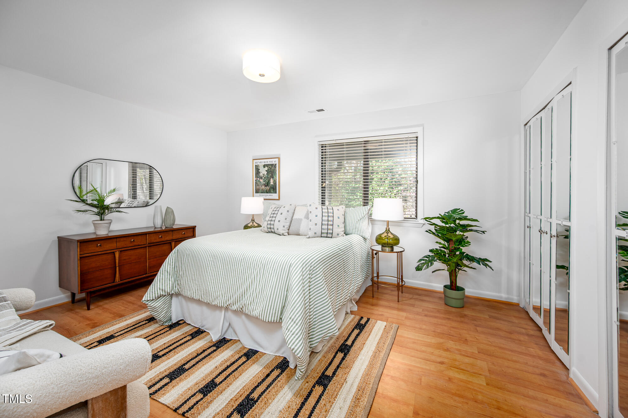 906 Oak Tree Drive Chapel Hill, NC 27517 - Photo 11 of 22 a bedroom with a large bed and a window